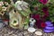 Small fairy cottage with petunia flowers outside in the garden