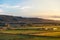 Small farm at sunrise / sunset in mountains