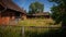 Small farm yard with barns and lush greenery in Germany