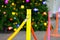 Small fence and colorful rope protect Christmas tree