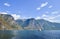 Small ferry exploring beautiful fjord Sognefjord with rocky shores and turquoise water