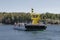 Small ferry passes the machine