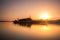 Small Fisher boat destroyed on the beach at sunrise