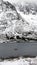Small fishing boat at Austnesfjorden viewpoint in the Lofoten in winter in Norway