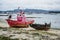 Small fishing boat beached on the sand of a beach