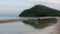 Small fishing boat and dingy sitting in tidal pool at low tide