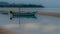 Small fishing boat and dingy sitting in tidal pool at low tide