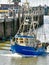 A small fishing boat enters the harbour of BÃ¼sum in North Frisia in Germany.