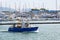 Small fishing boat leaves the port of the Tuscan town of Viareggio