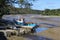 A small fishing boat moored while the tide is out in a estuary which eventually journeys to Padstow