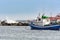 Small fishing boat at an ocean port of Santa Cruz town on Tenerife island, Spain.