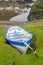 A small fishing boat secured onshore