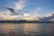 Small fishing boats and lonely man in the bay with magic of the sky and clouds at sunrise part 2