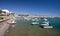 Small fishing boats and yachts moored in Roquets del Mar port or