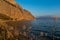 Small fishing hamlet of Kryoneri on the Gulf of Corinth with Vasarova mountain at sunset