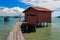 Small fishing house on a wooden bridge in Tan Jetty, part of the Clan Jetties, Georgetown, Penang, Malaysia