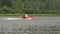 Small fishing powerboat moving quickly on the river in a summer time. slow motion