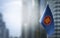 A small flag of ASEAN on the background of a blurred background