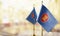 Small flags of the ASEAN on an abstract blurry background