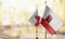 Small flags of the Gibraltar on an abstract blurry background