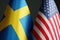 Small flags of Sweden and USA as a symbol of diplomacy.