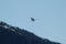 Small float plane flying over Alaska mountains