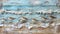 a small flock of sandpipers foraging for food along the surf, painted on an aged wooden board with a soothing blue and