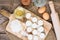 Small flour cookies on wooden board