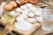 Small flour cookies on wooden board