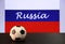 Small football on the black floor and Russian nation flag with the text of Russia background.