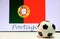 Small football on the white floor and Portuguese nation flag with the text of Portugal background.
