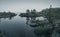 Small forested rocky islands in the fog