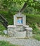 Small fountain with religious mosaic in monastery yard, Serbia