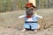 Small French Bulldog dog wearing a Carnival or Halloween cowboy full body costume with fake arms and pants