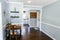 Small front area of house cut out made into a home office with hardwood floors