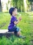 Small gentleman blowing the dandelions