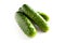 Small gherkins, delicious fresh cucumbers on a white background
