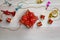 Small gift present box with colorful ribbon bow tie placed on wooden table with small decorative music instruments on Christmas