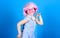 Small girl headphones pink wig dancing. Child using technology for fun. Modern headphones. Energy motion dance. Inspired