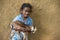 Small girl holding goat in hand in nangur Village near Jagdalpur,Chhattisgarh,India