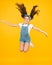 Small girl jump yellow background. full of energy. Active girl feel freedom. Fun and relax. feeling free. carefree kid