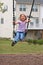 Small girl on playground swing