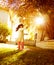 Small girl in sunny autumn day