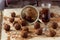 Small glass of brandy, gauze and homemade candies wooden table