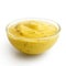 Small glass condiment bowl of yellow curry sauce. in p