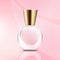 Small glass perfume bottle on abstract pink background