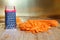 A small grater and a large carrot are on the cutting board. Unusual mystery and optical illusion