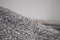 Small gray rubble or gravel, road surface. Background from a pile of small stones