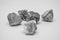 Small gray-white stones group on white background,Light and shadow under the rock, Five rocks