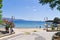 Small Greek village harbor on an Amoulani island, holy mountain Athos is in background